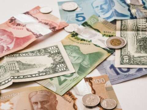 Small business owner reviewing merchant cash advance options with a financial advisor.