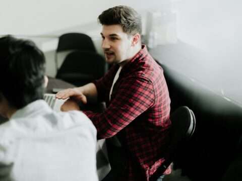 Entrepreneur discussing small business funding options during a meeting.