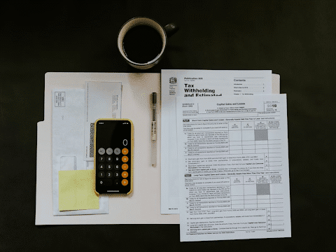 An image of a tax form and calculator.